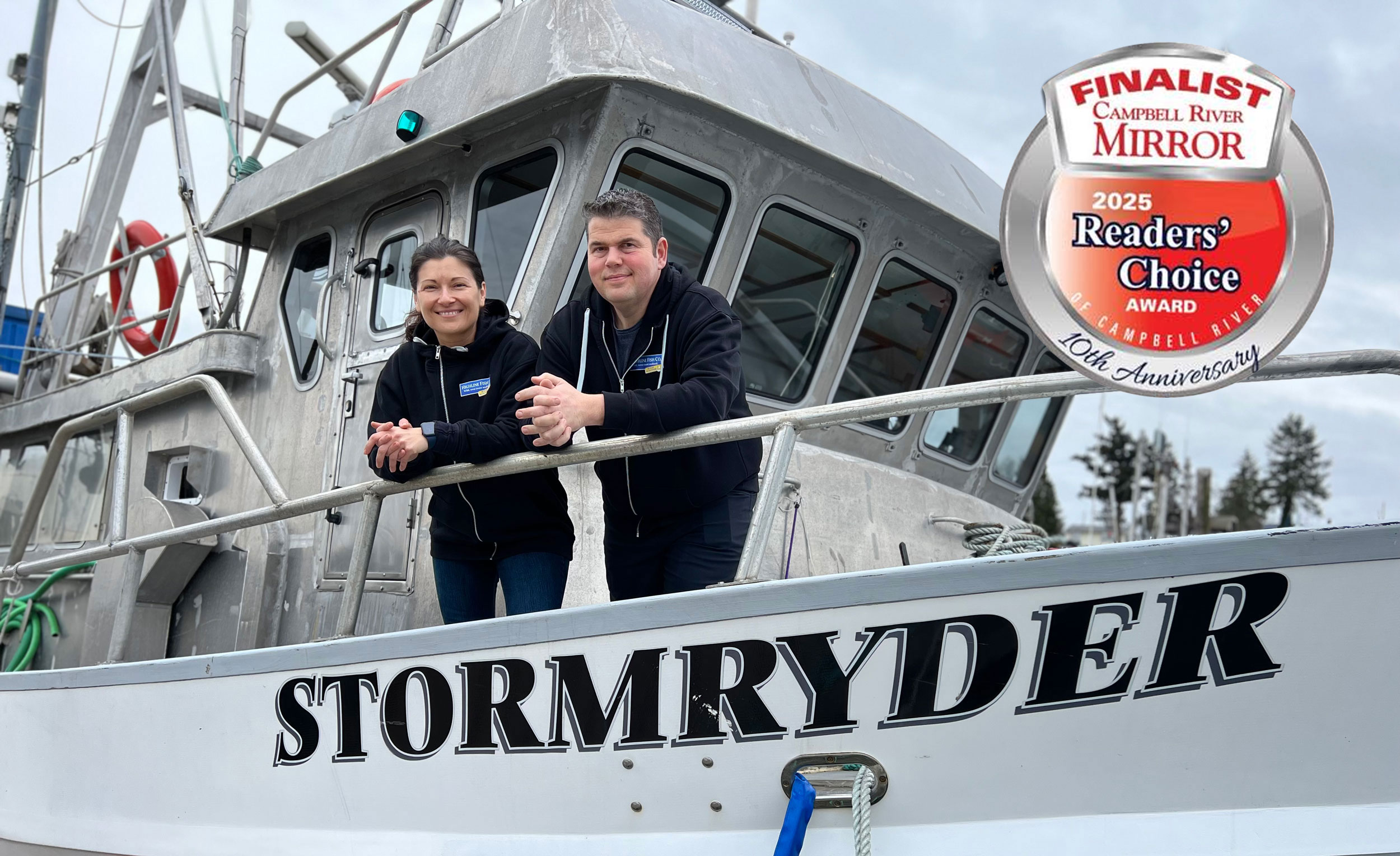 Zeke and Angy standing on the deck of the Stormryder, their fishing vessel.