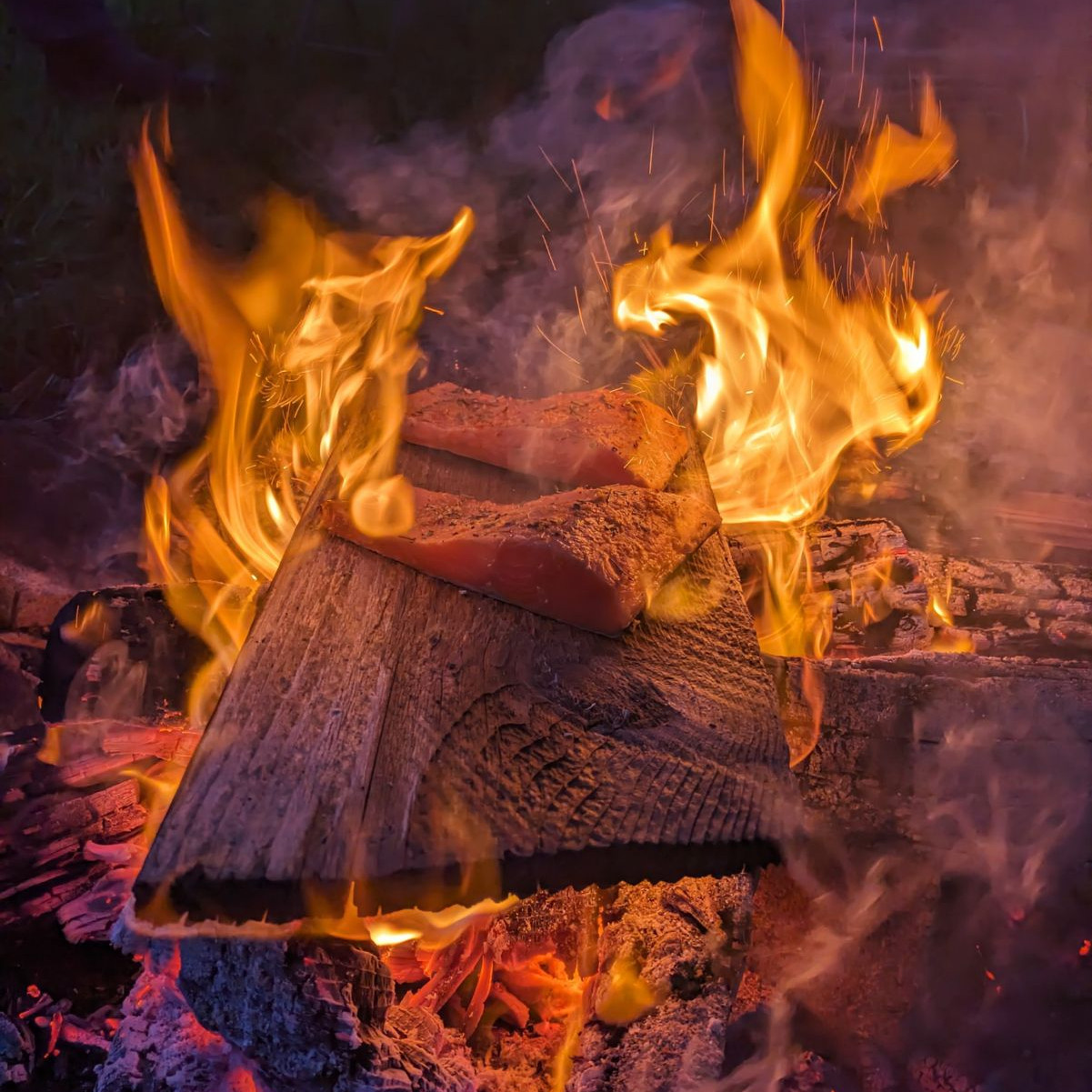 Cedar Plank Coho Salmon on a fire.