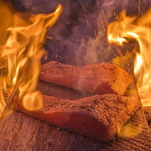 Cedar Plank Coho Salmon on a fire.